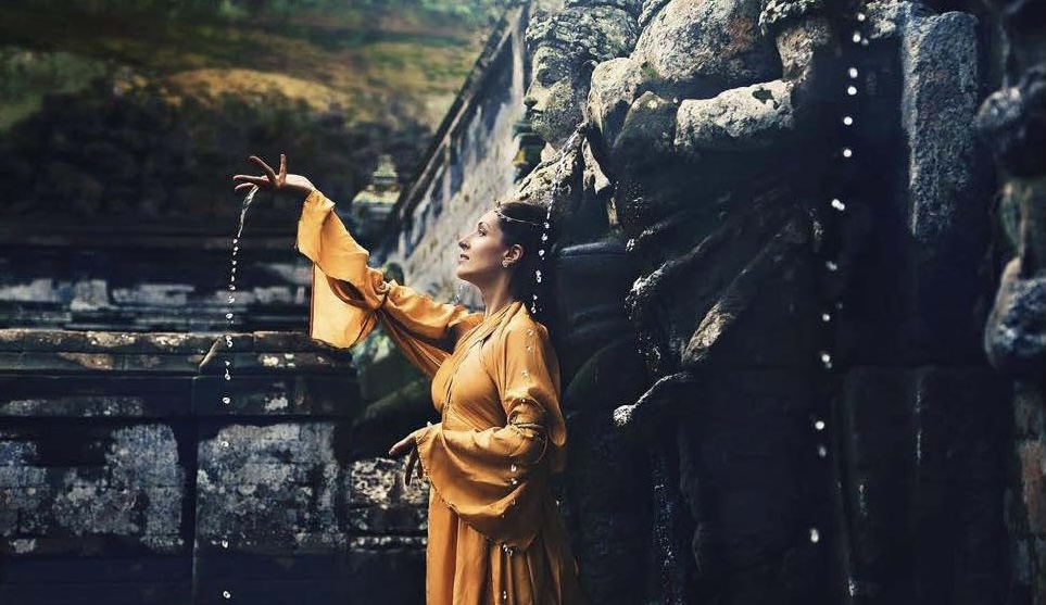 Lalita Shivani as Prakriti at ancient temple with water droplets